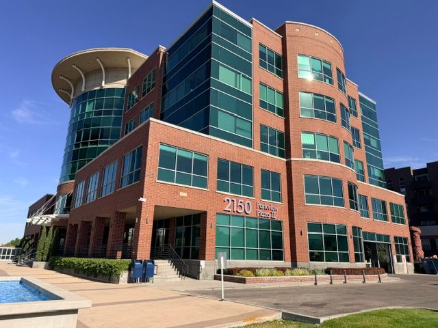 2150 Parkview Plaza II, with its curved rotunda and the plaza’s reflecting pool — one of the properties V2 manages in Sugar House, Salt Lake City.